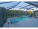 Screened in pool area featuring a pool, jacuzzi, and outdoor furniture creating a relaxing atmosphere at 12398 Keyridge Loop, Largo, FL 33778
