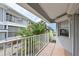 Outdoor balcony with views of lush tropical landscaping and nearby buildings at 1319 Perico Point Cir, Bradenton, FL 34209