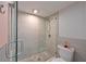Modern bathroom featuring tiled shower with glass door, rain shower head, and stylish fixtures at 1319 Perico Point Cir, Bradenton, FL 34209