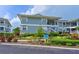 Well-maintained condo building with lush landscaping and clear signage at 1319 Perico Point Cir, Bradenton, FL 34209