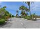 Well-maintained community entrance with lush landscaping, palm trees, and clear signage at 1319 Perico Point Cir, Bradenton, FL 34209