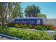 Perico Bay Club community sign surrounded by vibrant flowers and lush greenery at 1319 Perico Point Cir, Bradenton, FL 34209