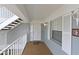 Inviting condo entrance with a 'Welcome' mat, window, and white railing at 1319 Perico Point Cir, Bradenton, FL 34209