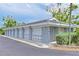 Detached garages with white doors offering convenient parking and storage for residents at 1319 Perico Point Cir, Bradenton, FL 34209