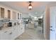Spacious kitchen with bright white cabinets, modern appliances, open floor plan, and natural light at 1319 Perico Point Cir, Bradenton, FL 34209