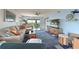 Cozy living room with stylish furnishings, coastal decor, and a view of the screened lanai at 1319 Perico Point Cir, Bradenton, FL 34209