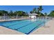 Community pool with clear blue water, lounge chairs, and well-maintained surroundings at 1319 Perico Point Cir, Bradenton, FL 34209