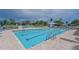 Community pool with clear blue water, lounge chairs, and well-maintained surroundings at 1319 Perico Point Cir, Bradenton, FL 34209