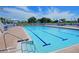 Beautiful swimming pool with lounge chairs and tables, great for relaxation and recreation at 1319 Perico Point Cir, Bradenton, FL 34209