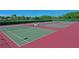 Well-maintained tennis courts surrounded by lush greenery, ideal for sports enthusiasts at 1319 Perico Point Cir, Bradenton, FL 34209