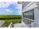 Screened lanai with view of the waterfront and vegetation at 1319 Perico Point Cir, Bradenton, FL 34209