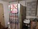 Finished basement bathroom with shower, toilet, and sink; perfect for added convenience at 1423 17Th E Ave, Bradenton, FL 34208