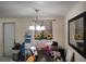 Dining area with table, lighting, and decor, adjacent to the kitchen at 1423 17Th E Ave, Bradenton, FL 34208