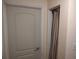 A white door next to a closet with beige curtains at 1423 17Th E Ave, Bradenton, FL 34208