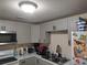 View of kitchen featuring gray cabinets, white appliances, and laminate countertops at 1423 17Th E Ave, Bradenton, FL 34208