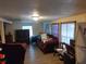 Cozy living room with wood floors, a comfortable couch, and natural light at 1423 17Th E Ave, Bradenton, FL 34208