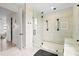 Modern bathroom with a glass shower, featuring rainfall shower head, bench and contemporary fixtures at 15815 Tradewind Ter, Bradenton, FL 34211