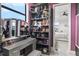 Well-organized closet with vanity area, featuring custom storage for purses, makeup, and jewelry at 15815 Tradewind Ter, Bradenton, FL 34211