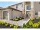 The front of this home features an inviting entrance with stone accents and meticulously landscaped walkway at 15815 Tradewind Ter, Bradenton, FL 34211