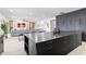 Contemporary kitchen featuring a large island with bar seating that seamlessly connects to the adjacent living space at 15815 Tradewind Ter, Bradenton, FL 34211