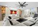 Bright living room boasts a modern media center, comfortable seating, and a clear view of the front entrance at 15815 Tradewind Ter, Bradenton, FL 34211