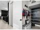 Well-organized mud room with built-in storage, chalkboard wall, and convenient bench seating for easy transitions at 15815 Tradewind Ter, Bradenton, FL 34211