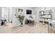 Well-lit home office with modern decor, functional storage, and a comfortable workspace for productivity at 15815 Tradewind Ter, Bradenton, FL 34211