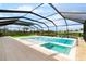 Relaxing pool with a spa and screen enclosure offering picturesque views of the serene surroundings at 15815 Tradewind Ter, Bradenton, FL 34211