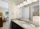 Bathroom featuring a double sink vanity with granite countertops at 16628 Berwick Ter, Lakewood Ranch, FL 34202