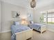 Bright bedroom with two twin beds and nautical-themed decor at 16628 Berwick Ter, Lakewood Ranch, FL 34202
