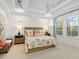 Bright bedroom with tray ceiling and a ceiling fan, offering a peaceful retreat at 16628 Berwick Ter, Lakewood Ranch, FL 34202