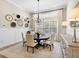Cozy dining room with natural lighting and a modern chandelier, perfect for Gathering meals at 16628 Berwick Ter, Lakewood Ranch, FL 34202