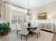 Bright dining area featuring a round table and large window offering natural light at 16628 Berwick Ter, Lakewood Ranch, FL 34202