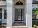 Inviting front entrance features a decorative glass door, transom window and beautiful brick pavers at 16628 Berwick Ter, Lakewood Ranch, FL 34202