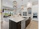 Bright kitchen with a large island, stainless steel appliances, and open access to the living and outdoor areas at 16628 Berwick Ter, Lakewood Ranch, FL 34202