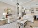 Expansive living room with open floor plan to kitchen, wood floors, and neutral furniture at 16628 Berwick Ter, Lakewood Ranch, FL 34202