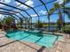 Picture-perfect view of the pool and spa, framed by tropical landscaping and a screened enclosure at 16628 Berwick Ter, Lakewood Ranch, FL 34202