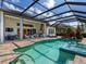 Enjoy this screened pool with a covered patio, outdoor kitchen, and brick-paver deck, perfect for entertaining at 16628 Berwick Ter, Lakewood Ranch, FL 34202
