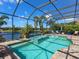 Enjoy the pool and spa while taking in picturesque views of the lake from the comfort of this screened lanai at 16628 Berwick Ter, Lakewood Ranch, FL 34202