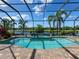 Spectacular screened pool and lanai area offering a private oasis with lush landscaping and stylish patio furniture at 16628 Berwick Ter, Lakewood Ranch, FL 34202