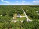 Aerial view of the property, highlighting its landscaping and expansive green space at 17211 Drayton Ln, Port Charlotte, FL 33948