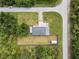 Aerial view of the property showcasing a fenced backyard and storage shed at 17211 Drayton Ln, Port Charlotte, FL 33948