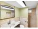 The bathroom features an updated vanity and tile shower at 17211 Drayton Ln, Port Charlotte, FL 33948