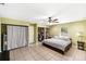 Large bedroom with neutral paint, tile flooring, and open closet space at 17211 Drayton Ln, Port Charlotte, FL 33948