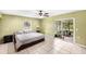 Bright bedroom with tile floor, sliding glass doors, and neutral decor at 17211 Drayton Ln, Port Charlotte, FL 33948