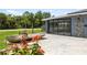 Exterior showcasing a concrete patio and sliding glass doors leading to the interior at 17211 Drayton Ln, Port Charlotte, FL 33948