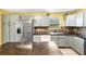 Bright kitchen with stainless steel appliances and granite countertops at 17211 Drayton Ln, Port Charlotte, FL 33948