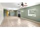 Open-concept living space with tile flooring and large windows at 17211 Drayton Ln, Port Charlotte, FL 33948