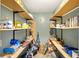 Organized pantry featuring shelves, offering ample storage for groceries and household supplies in a well-maintained space at 17211 Drayton Ln, Port Charlotte, FL 33948