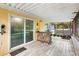 Covered patio featuring tile flooring, stone bar, and view of the backyard at 17211 Drayton Ln, Port Charlotte, FL 33948